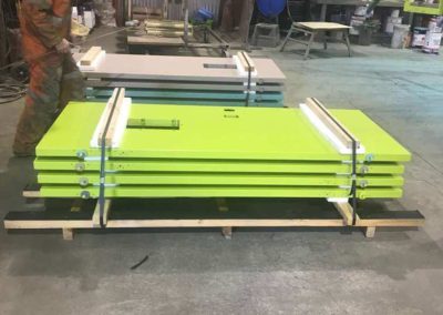 New Prison doors which have been painted with different coloured 2 pack epoxy paint manufactured in South Australia, packaged for delivery to New Zealand