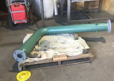 An elbow Gas pipe which has had the final topcoat surface coating applied