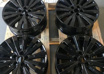 4 mag wheels that have been abrasive blasted undercoated and powder coated