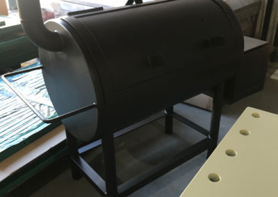 Outdoor metal smoker which has been abrasive blasted and painted black