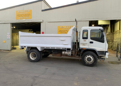 Truck bin on tip truck which was abrasive blasted, epoxy primed and Polyurethane top coat applied whilst still attached to the truck and the company signage applied - after